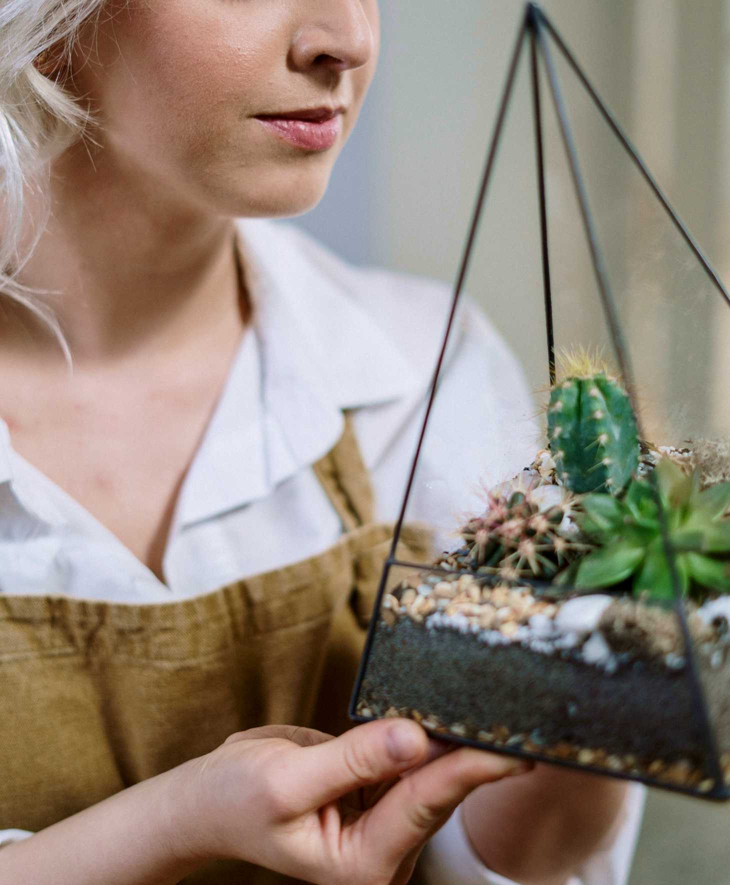 woman holding a terrarium