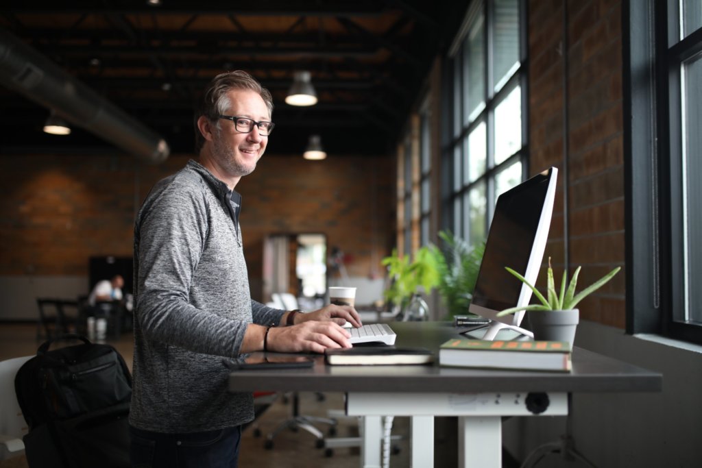 a man with succulent on his office desk