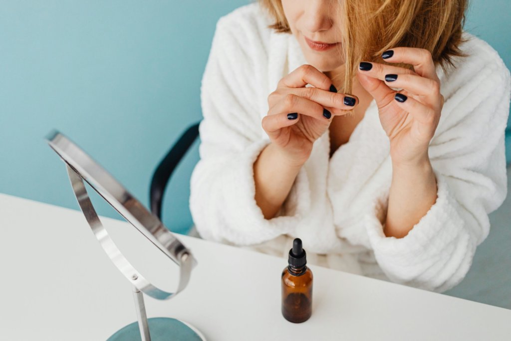 applying cactus oil on hair